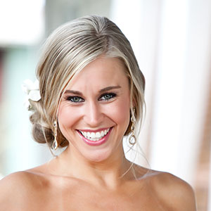 Woman smiling in wedding dress after seeing her cosmetic dentist in North Dallas Texas