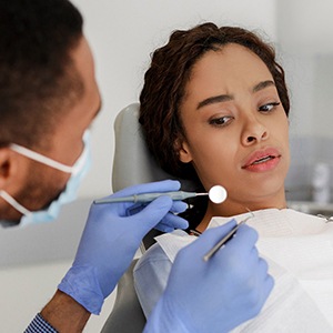 Woman afraid in the dental chair