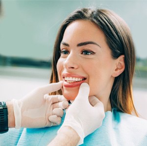 A dentist assessing his patient for cosmetic dentistry