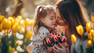 mother and daughter in a field of flowers