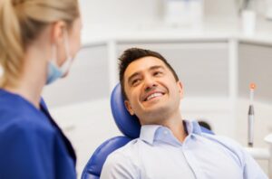 Man smiling after dental crown placement